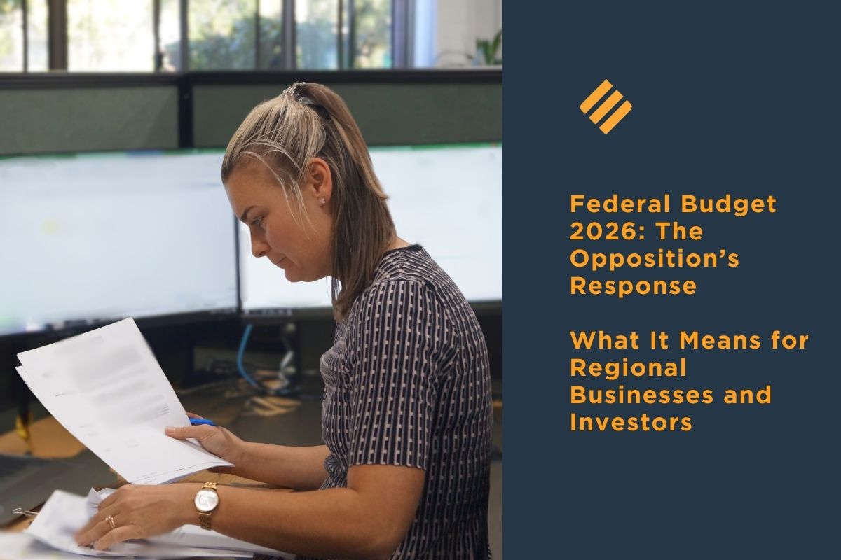 JMME advisor reviewing paperwork beside headline about the Opposition’s response to the 2026 Federal Budget and its impact on regional businesses and investors.